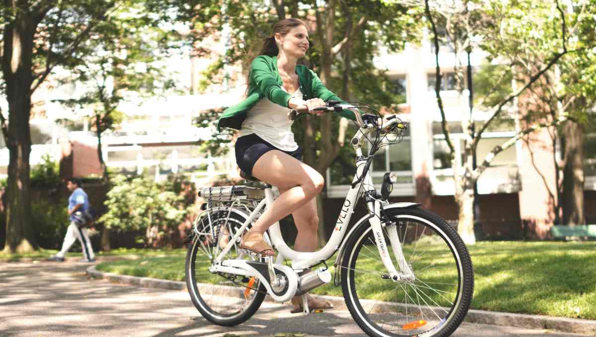 A woman using touring ebike in the park