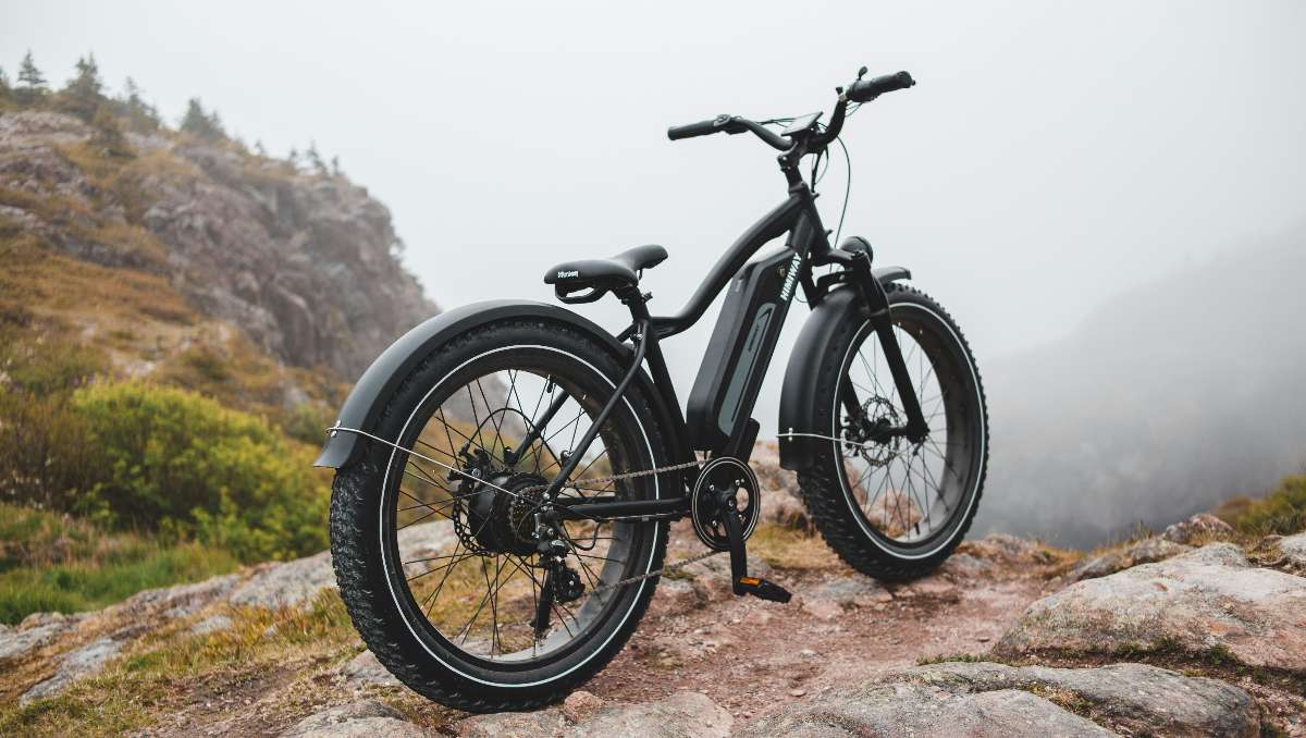 An electric bike on top of a mountain hill.