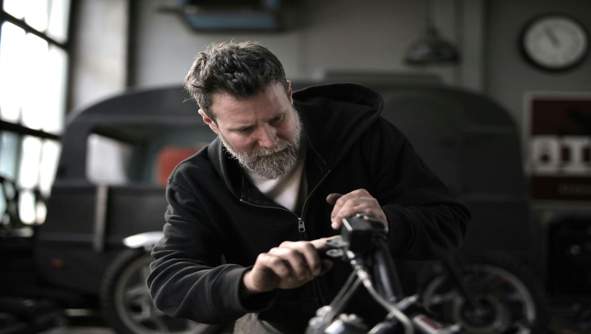 Man converting a bicycle into electric