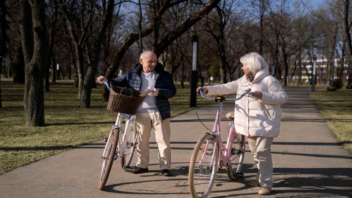 Two seniors riding e-bikes