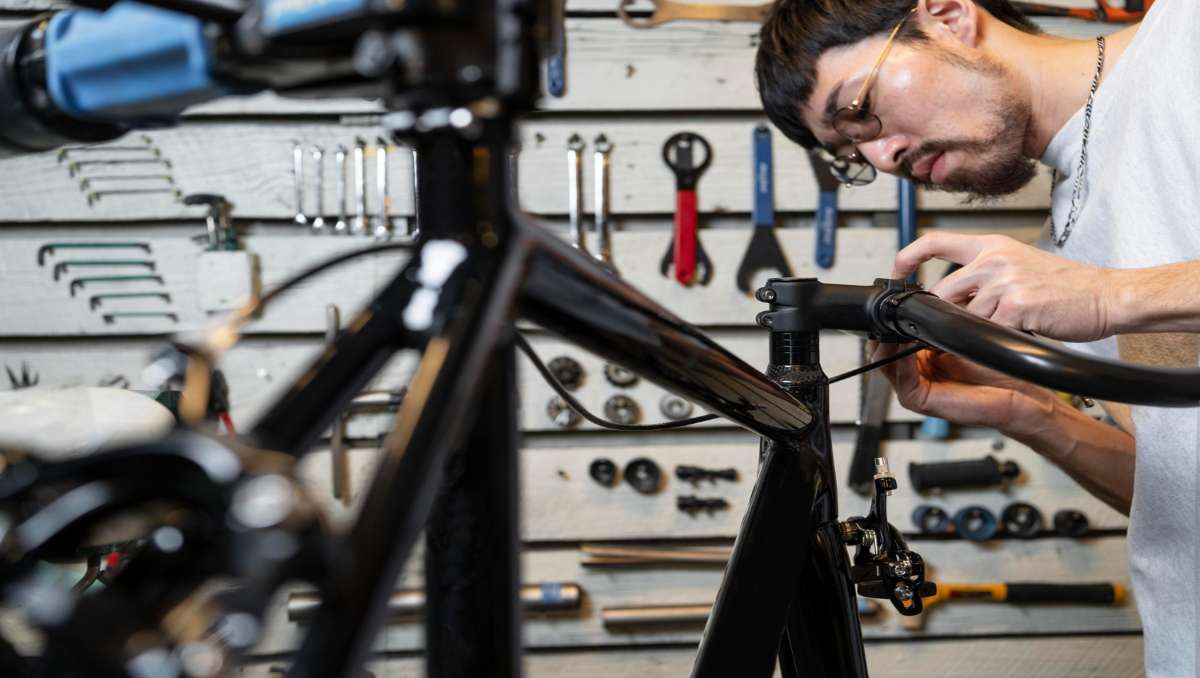 man doing e-bike assembly