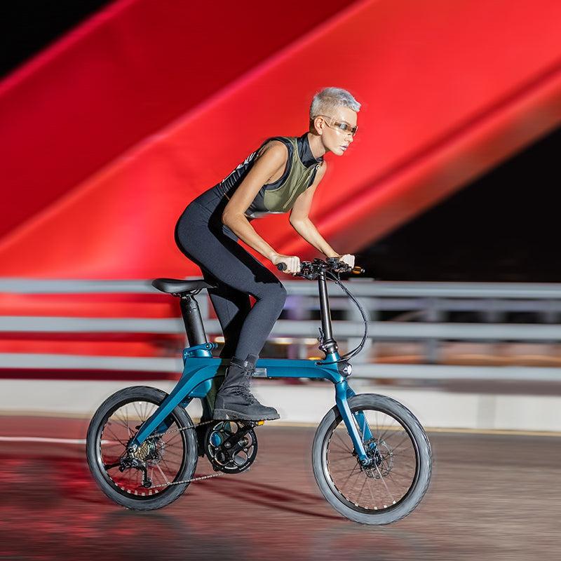 woman riding Fiido X Upgraded 350W Lightweight Folding Electric Bike