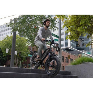Troxus-Skyhopper-750W-Step-Thru-Fat-Tire-Electric-Bike-Step-Through-Troxus-Mobility-Man Riding ebike in stair